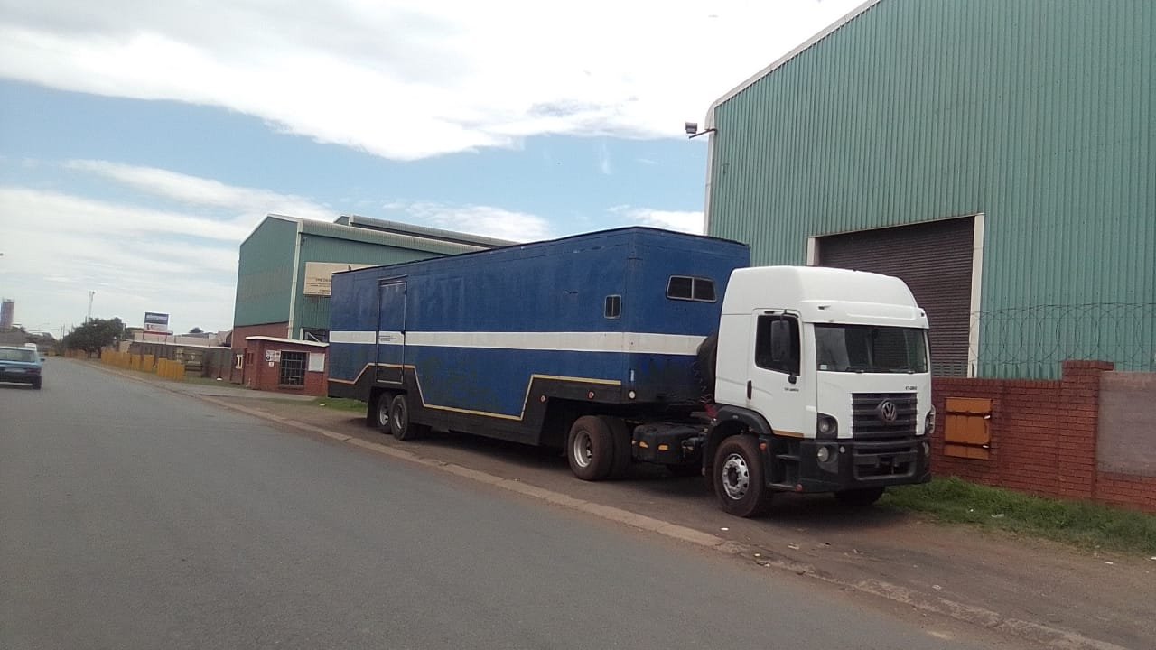 City on the Move truck parked outside a warehouse in an industrial area