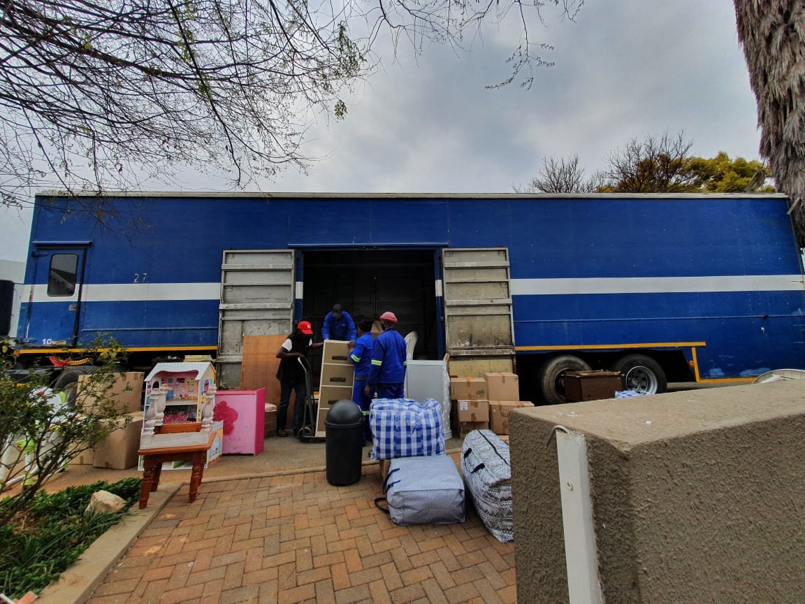 City on the Move crew loading household furniture and belongings into a truck